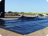 Laying out the geotextile and unfolding the liner may not be possible on windy days.