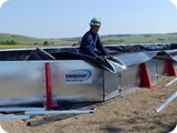 Once wall set-up is complete, unfold remaining liner over wall and secure with ridge cap.